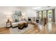 Upstairs living room featuring hardwood floors, a comfortable seating area, and ample natural light at 2553 Creekwood Ter, Decatur, GA 30030