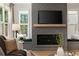 Stylish living room with a herringbone fireplace and comfortable seating at 2553 Creekwood Ter, Decatur, GA 30030