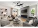 Cozy living room with a fireplace, comfortable seating, and natural light at 2553 Creekwood Ter, Decatur, GA 30030