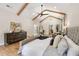 Spacious main bedroom with vaulted ceiling, exposed wood beams, and hardwood floors at 2553 Creekwood Ter, Decatur, GA 30030