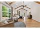 Spacious main bedroom features vaulted ceilings, hardwood floors, large windows, and access to a private balcony at 2553 Creekwood Ter, Decatur, GA 30030