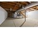 Spacious unfinished basement area with concrete floor, wooden beams, and utility connections at 470 Hunnicutt Se Rd, Mableton, GA 30126