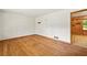 Empty room with hardwood floors, blank walls, and a doorway leading to an adjacent space at 470 Hunnicutt Se Rd, Mableton, GA 30126