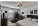 Cozy bedroom with a queen bed, ceiling fan, and a walk-in closet at 1189 Norfolk Nw Dr, Acworth, GA 30102
