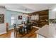 A dining area next to the kitchen featuring an accent wall and bamboo flooring at 1189 Norfolk Nw Dr, Acworth, GA 30102
