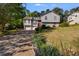 Charming two-story home with a manicured front lawn, red door, and attached two-car garage at 1189 Norfolk Nw Dr, Acworth, GA 30102