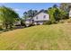 Well-maintained two-story home with a lush front lawn and landscaped surroundings at 1189 Norfolk Nw Dr, Acworth, GA 30102