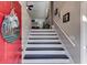 Inviting foyer with a bright red door, and stairs leading to the upper level at 1189 Norfolk Nw Dr, Acworth, GA 30102