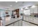 Bright kitchen with granite countertops, stainless appliances, and a unique wood accent wall at 1189 Norfolk Nw Dr, Acworth, GA 30102