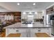 Bright kitchen with stainless steel appliances, and a large center island with seating at 1189 Norfolk Nw Dr, Acworth, GA 30102
