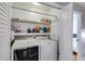 Convenient laundry room setup with modern washer and dryer units inside of a closet at 1189 Norfolk Nw Dr, Acworth, GA 30102