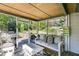 Cozy screened-in porch with comfortable seating and a view of the backyard at 1189 Norfolk Nw Dr, Acworth, GA 30102