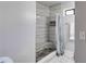 Modern bathroom with a shower, built in shelf, and pebble flooring at 1189 Norfolk Nw Dr, Acworth, GA 30102