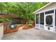 Backyard patio and screened in porch with mature trees providing privacy and shade at 2870 Abbottswell Dr, Alpharetta, GA 30022