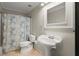 Small bathroom with a toilet, pedestal sink and bath tub at 2870 Abbottswell Dr, Alpharetta, GA 30022