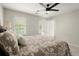 Cozy bedroom with a ceiling fan, neutral colored walls, carpet, and windows at 2870 Abbottswell Dr, Alpharetta, GA 30022