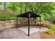 Backyard patio with brick pavers and gazebo nestled in the trees at 2870 Abbottswell Dr, Alpharetta, GA 30022
