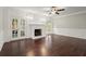 Spacious living room featuring hardwood floors, a fireplace, and natural lighting at 2870 Abbottswell Dr, Alpharetta, GA 30022