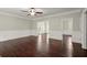 Bright living room featuring hardwood floors and classic white wainscoting at 2870 Abbottswell Dr, Alpharetta, GA 30022