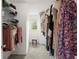 Walk-in closet with installed shelving and a window for natural light at 2870 Abbottswell Dr, Alpharetta, GA 30022