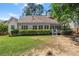 Spacious backyard with lush green lawn and a charming patio area, great for outdoor activities at 6250 Bannerhorn Run, Alpharetta, GA 30005