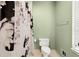 Bathroom featuring a decorative shower curtain and a neutral color palette at 6250 Bannerhorn Run, Alpharetta, GA 30005