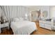 Inviting bedroom boasts wood floors, with a white color scheme and a view of the hallway at 6250 Bannerhorn Run, Alpharetta, GA 30005
