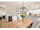 Bright dining room features hardwood floors, fireplace, and white trim at 6250 Bannerhorn Run, Alpharetta, GA 30005