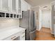 Kitchen with stainless steel appliances and white cabinetry at 6250 Bannerhorn Run, Alpharetta, GA 30005