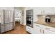 Kitchen featuring stainless steel appliances, granite countertops, and white cabinetry at 6250 Bannerhorn Run, Alpharetta, GA 30005