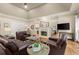 Inviting living room with a fireplace, hardwood floors, and ample seating at 6250 Bannerhorn Run, Alpharetta, GA 30005