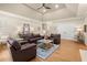 Comfortable living room with a high ceiling, hardwood floors, and stylish furniture at 6250 Bannerhorn Run, Alpharetta, GA 30005