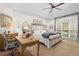 Main bedroom with desk and ceiling fan at 6250 Bannerhorn Run, Alpharetta, GA 30005