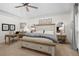 Main bedroom with ceiling fan, desk, and carpet at 6250 Bannerhorn Run, Alpharetta, GA 30005