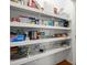 Pantry with shelving for storage of food and kitchen supplies at 6250 Bannerhorn Run, Alpharetta, GA 30005