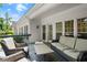 Cozy patio with wicker furniture, perfect for outdoor relaxation and entertainment at 6250 Bannerhorn Run, Alpharetta, GA 30005