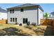 Well-kept back exterior with wood fencing, windows, and a sliding door at 660 Stately Dr, Woodstock, GA 30188