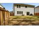 A spacious backyard with a wood fence and sliding door access from the home's lower level at 660 Stately Dr, Woodstock, GA 30188