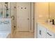Bathroom with a vanity and granite countertop, mirror and shower with decorative tile at 660 Stately Dr, Woodstock, GA 30188