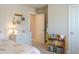 Charming bedroom with dresser, open doorway, and bookshelf, creating a cozy atmosphere at 660 Stately Dr, Woodstock, GA 30188