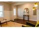 Inviting foyer featuring hardwood floors, wainscoting, and stylish decor at 660 Stately Dr, Woodstock, GA 30188