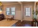 Bright foyer with hardwood floors, wainscoting, and a front door with decorative glass at 660 Stately Dr, Woodstock, GA 30188