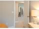Hallway with carpet and a view of the stairway; table and lamp visible in foreground at 660 Stately Dr, Woodstock, GA 30188