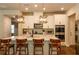 Beautiful kitchen with white cabinets, a quartz countertop island, and stainless steel appliances at 660 Stately Dr, Woodstock, GA 30188