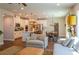 Open-concept living area with a modern kitchen, dining area, and comfortable seating at 660 Stately Dr, Woodstock, GA 30188