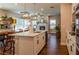 Open concept living room boasts a modern kitchen, fireplace, and large windows at 660 Stately Dr, Woodstock, GA 30188