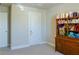 Neutral room with carpet, storage, and two doors; potential craft room or office at 660 Stately Dr, Woodstock, GA 30188