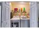 Bright laundry closet featuring a washer, dryer, and storage shelves for convenience at 7750 Carnegie Dr, Fairburn, GA 30213