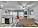 Cozy open-concept living room with granite countertops, stainless appliances, and fireplace feature at 7750 Carnegie Dr, Fairburn, GA 30213