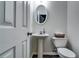 Neat powder room features modern sink and toilet with neutral walls at 7750 Carnegie Dr, Fairburn, GA 30213